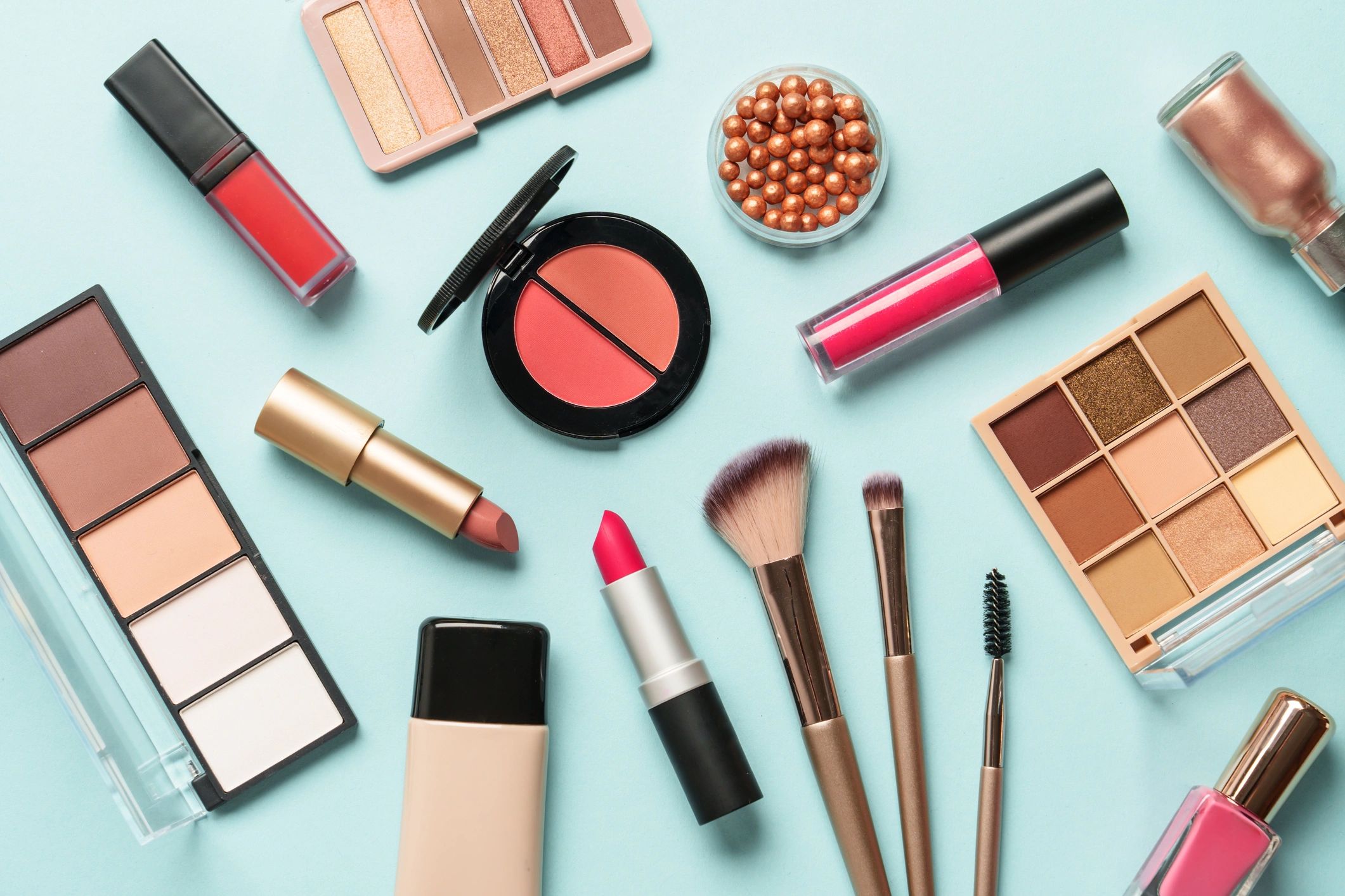 Beauty products arranged on blue background