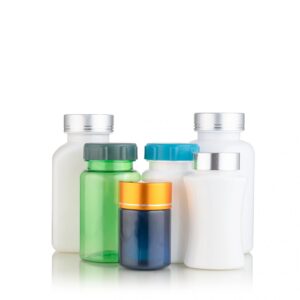 assorted cosmetic bottles on white background